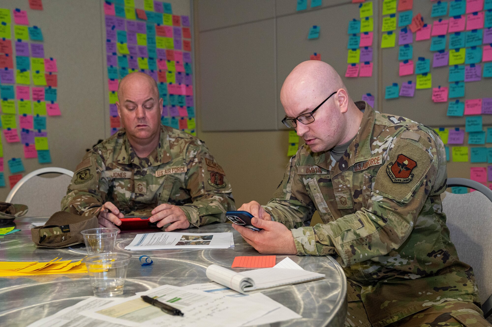 U.S. Air Force Senior Master Sgt. Steven Jones, 601st Air Operations Center Detachment 1 superintendent, and Master Sgt. Kenneth Davis, Air Force Career Development Academy command and control battle management operations learning engineer, work together at the occupational competency seminar on Keesler Air Force Base, Mississippi, March 19, 2024.