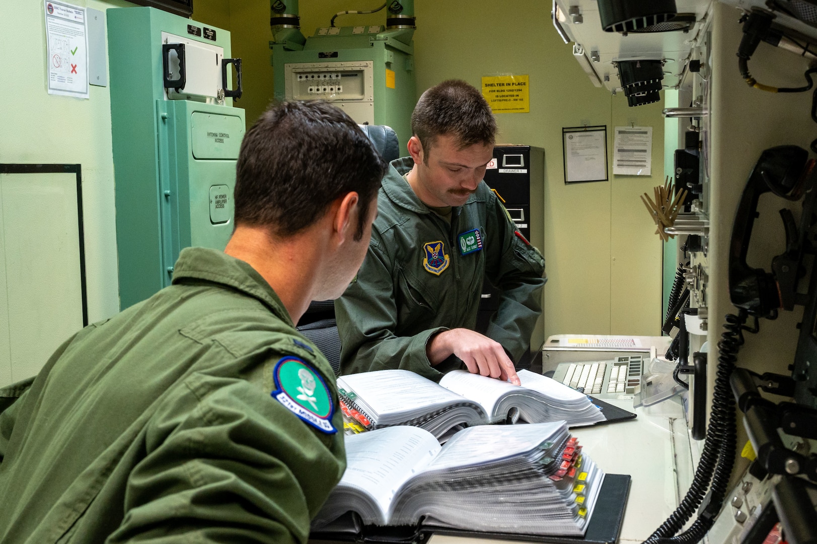 missileers at a missile procedures trainer console