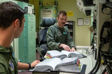 missileers at a missile procedures trainer console