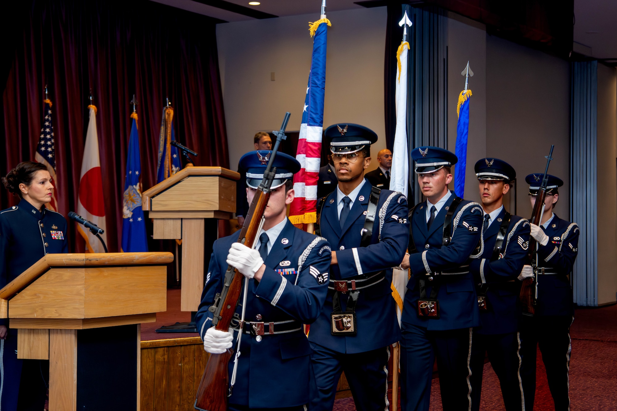 Yokota Air Base Honor Guardsmen present the colors.