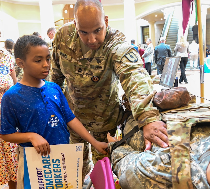 U.S. Soldiers and Airmen with the Pennsylvania National Guard host the annual Guard Day at the Capitol in Harrisburg, Pennsylvania, June 4, 2024. This event educates state legislators, staff and visitors about the role the Army and Air National Guard plays in the Commonwealth, as well as the opportunities they offer. They had multiple displays around the rotunda in the Capitol that helped showcase the different jobs in the military. Soldiers and Airmen presented their knowledge and skills to the interested legislators, staff and visitors. (U.S. Army National Guard photo by Spc. Jessica Barb)