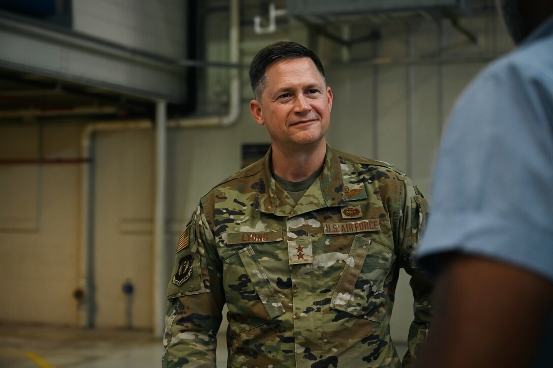 An Air Force General stands with a smile on his face