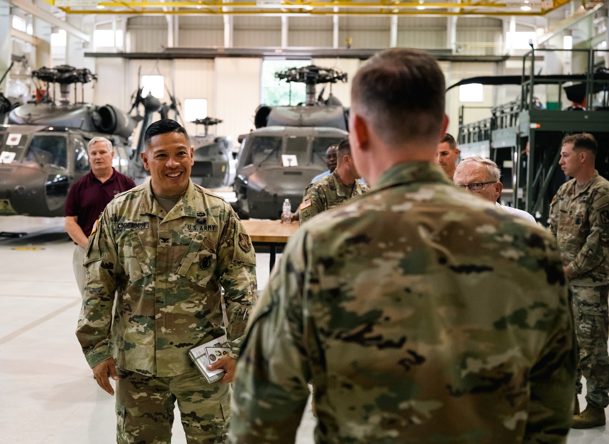 A Soldier smiles at an Airman