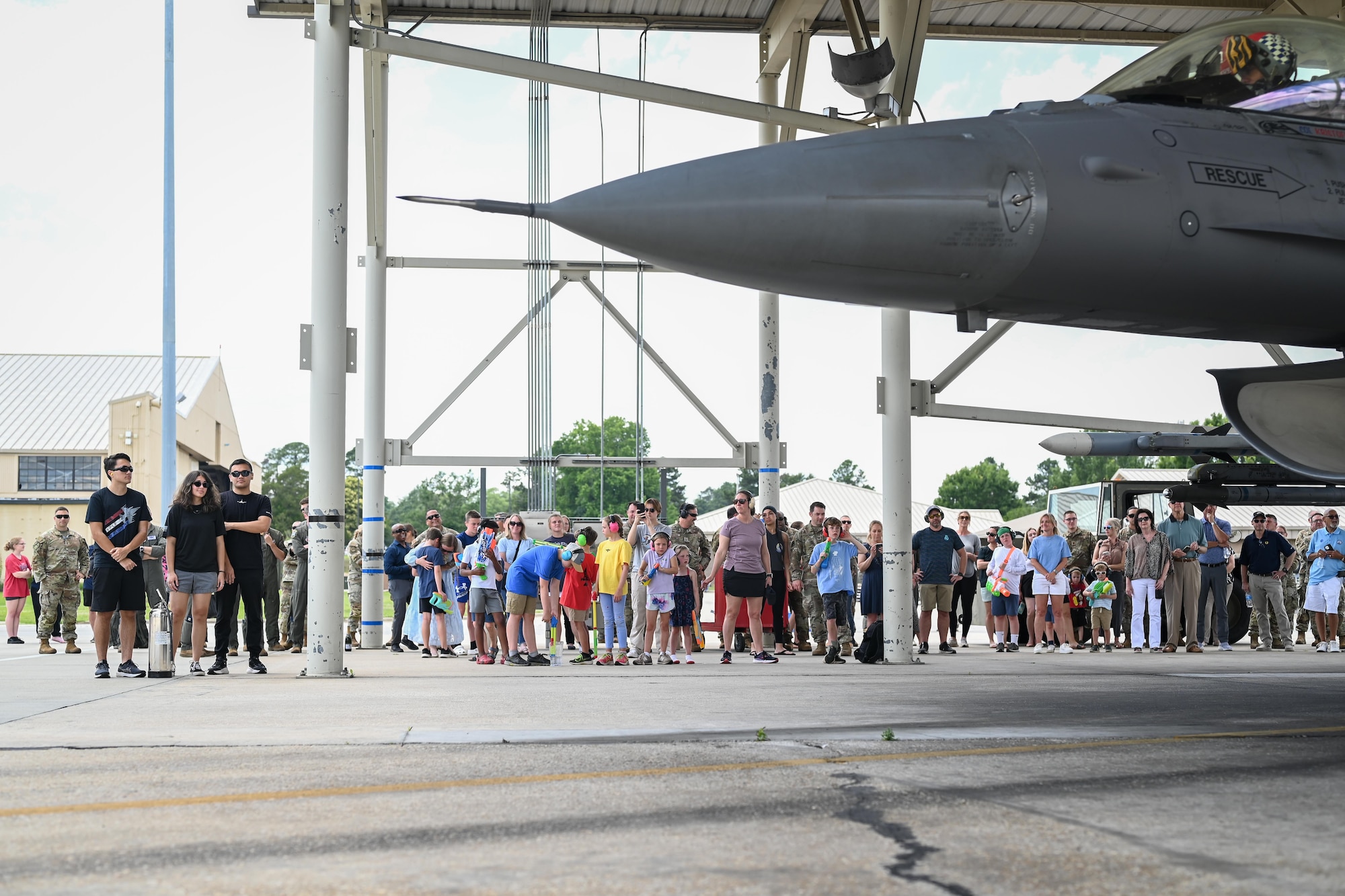 A crowd waits for Col. Smith's aircraft.