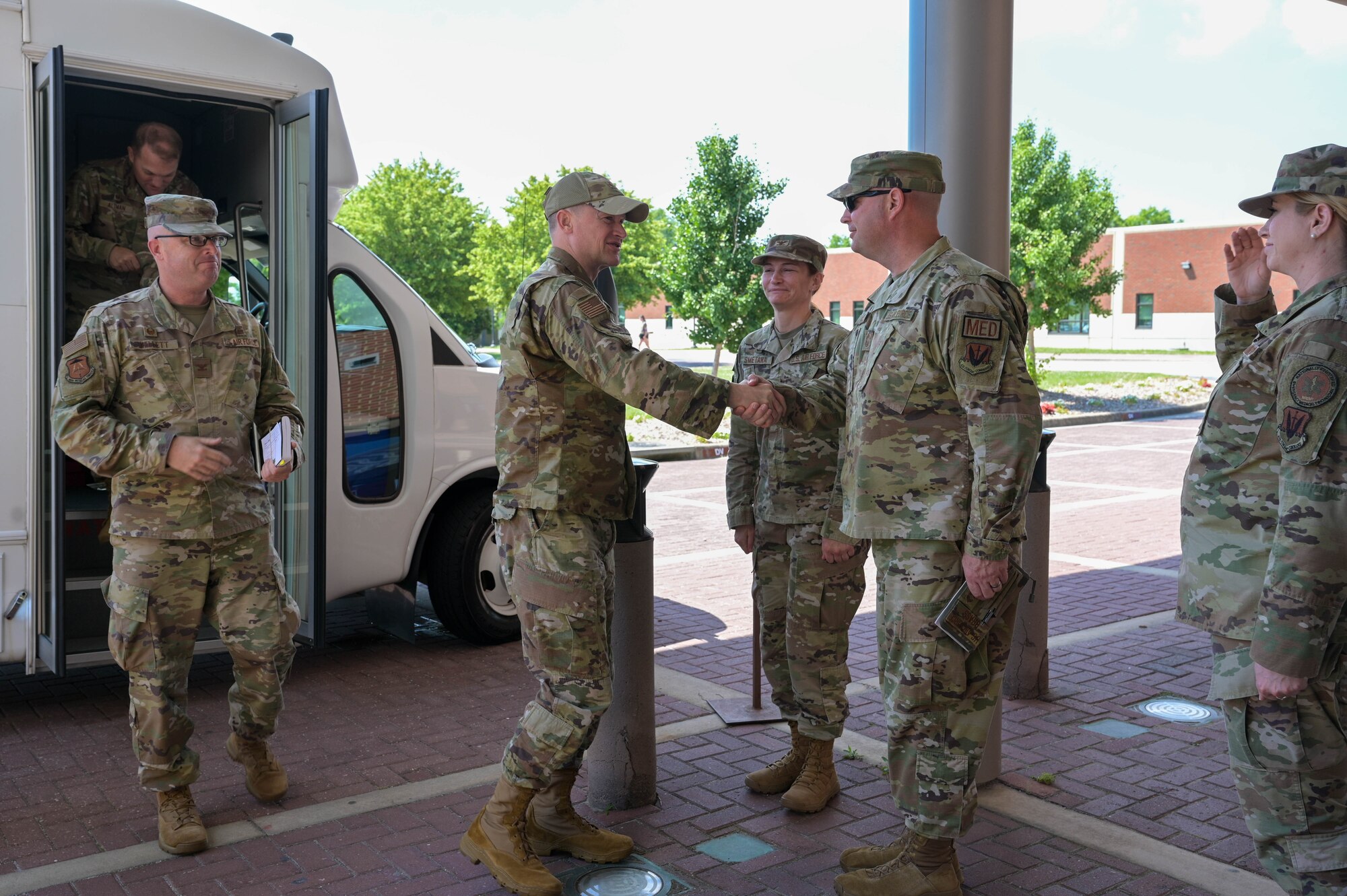 U.S. Air Force Maj. Gen. David Lyons, Fifteenth Air Force commander, left, is greeted by Chief Master Sgt. Vincent Brass, 633d Medical Group senior enlisted leader, at Joint Base Langley-Eustis, Virginia, June 4, 2024. Lyons visited various JBLE agencies to see how the partnership between the Air Force and Army provide a greater strategic advantage to higher Department of Defense priorities. (U.S. Air Force photo by Airman 1st Class Adisen Smith)