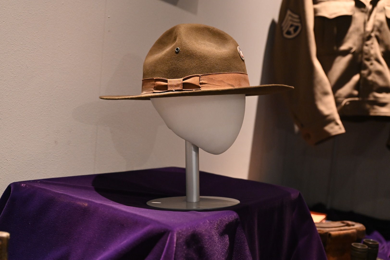 A hat worn by a member of the 29th Infantry Division (29ID) is on display in the District of Columbia National Guard Museum highlighting the contributions of eight mobilized units in support of WWII in Europe, the Pacific and at home, June 5, 2024. Three landed on Omaha Beach and fought in the Battle of Normandy or Operation Overlord (D-Day): The 29th Military Police Platoon (MP PLT), Headquarters and Headquarters Company (HHC) of the 29th Infantry Division (29ID), and the 121st Engineer Combat Battalion (ECB).