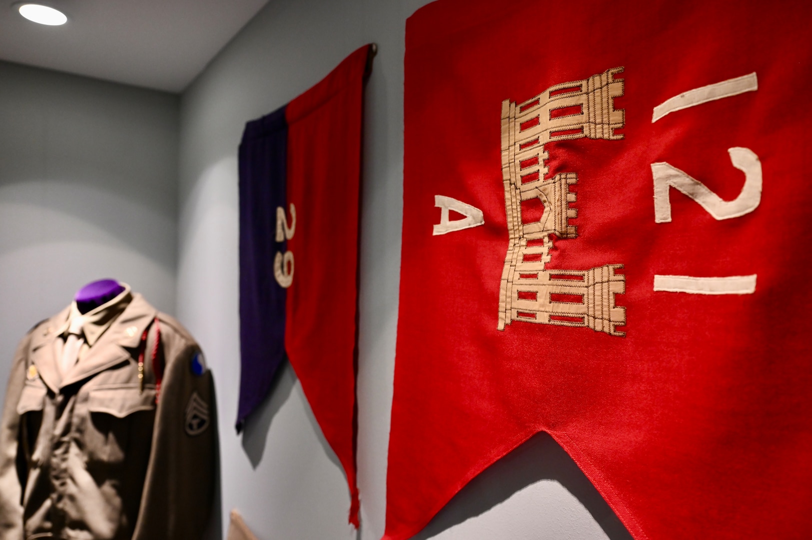 Guidons for the 121st Engineer Battalion and 29th Infantry Division are on display in the District of Columbia National Guard Museum, at the D.C. Armory, June 5, 2024. Three D.C. National Guard units landed on Omaha Beach and fought in the Battle of Normandy or Operation Overlord (D-Day): The 29th Military Police Platoon (MP PLT), Headquarters and Headquarters Company (HHC) of the 29th Infantry Division (29ID), and the 121st Engineer Combat Battalion (ECB).