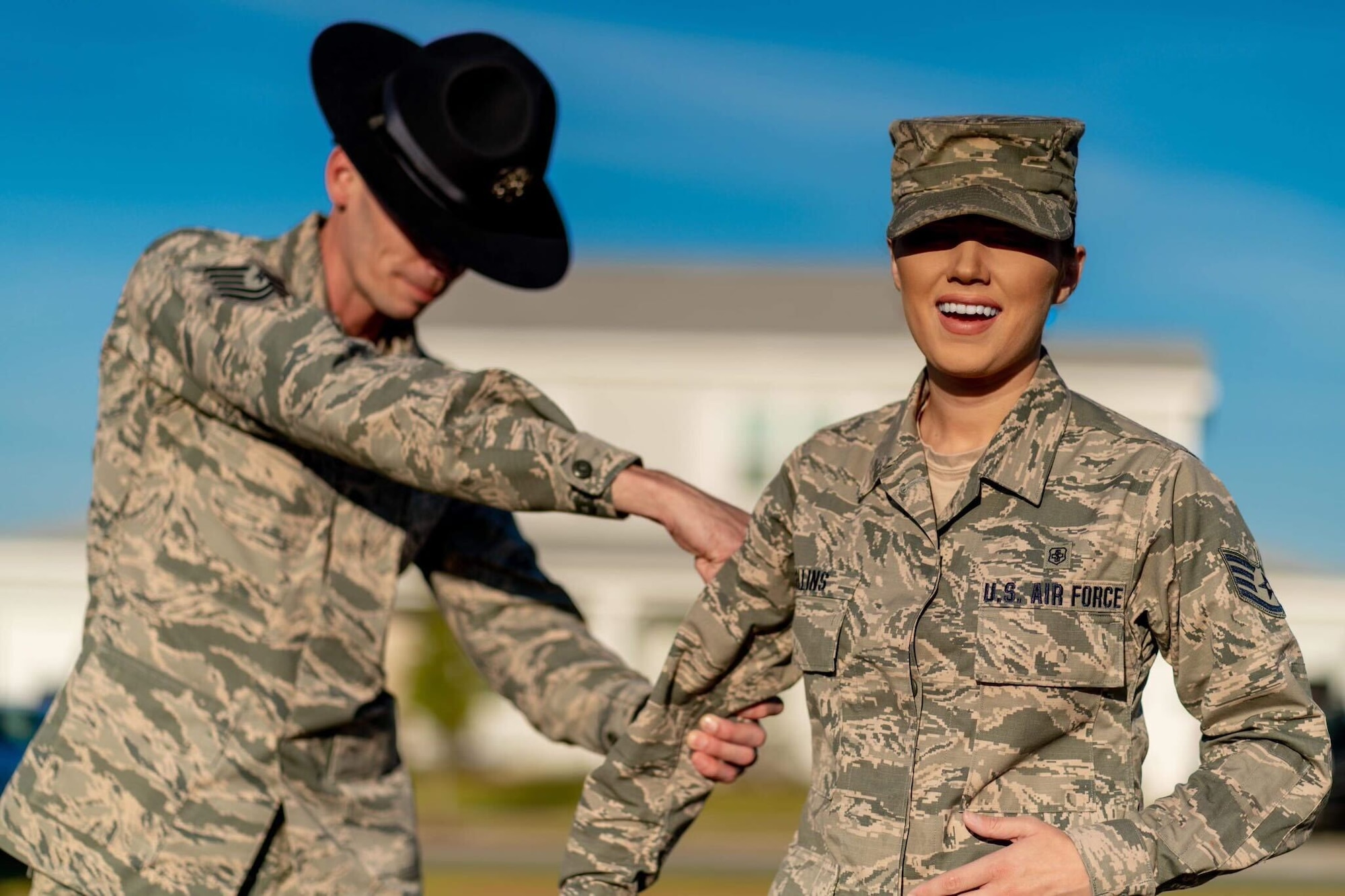 U.S. Air Force Tech. Sgt. Adam Neely (now retired Master Sgt. Neely) promotes Staff Sgt. Samantha Collins (now 1st. Lt. Collins) at Eglin Air Force Base, Florida, 2018. Collins is the eldest daughter of Neely. (courtesy photo)