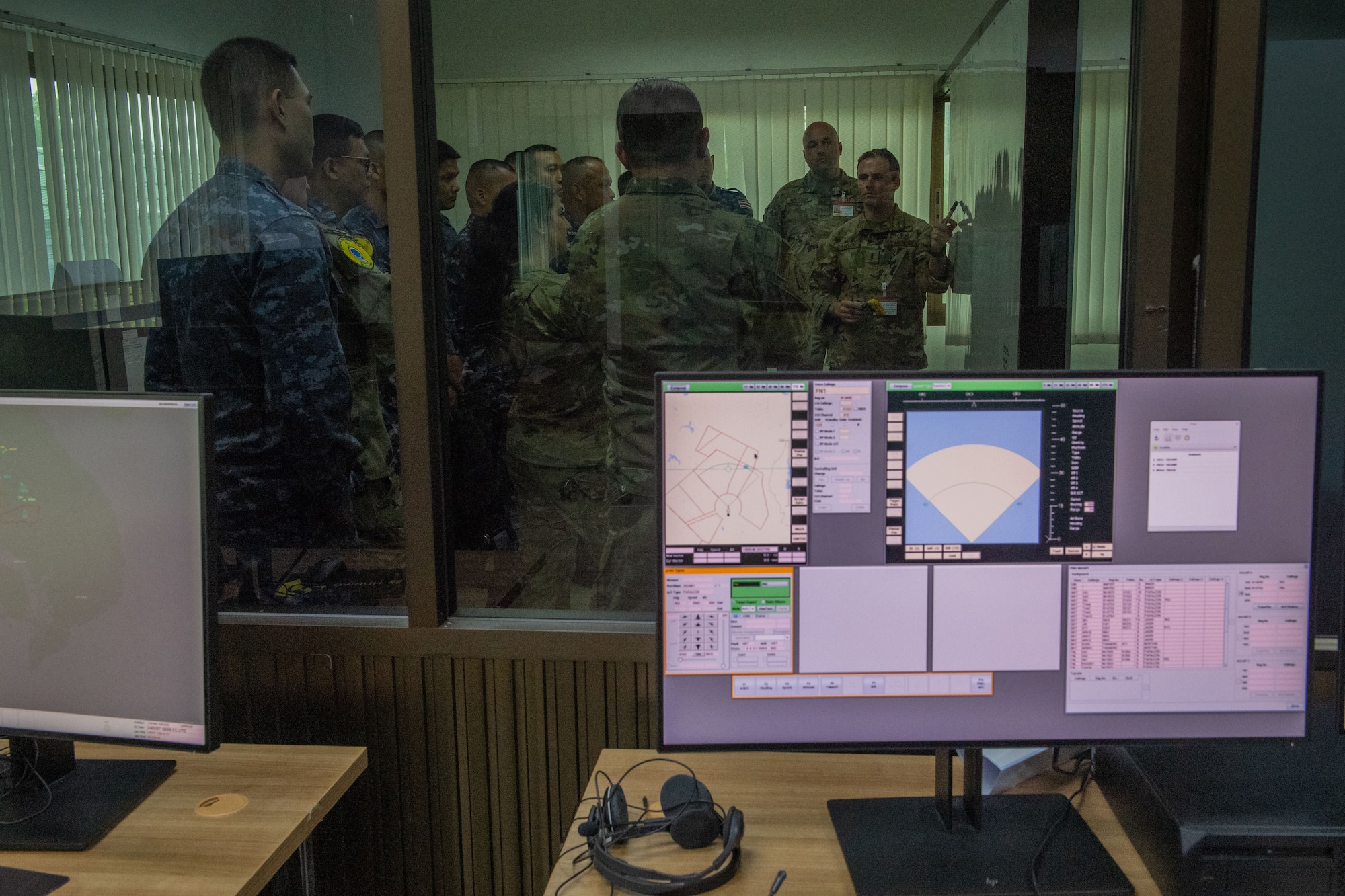 Airmen receiving a briefing
