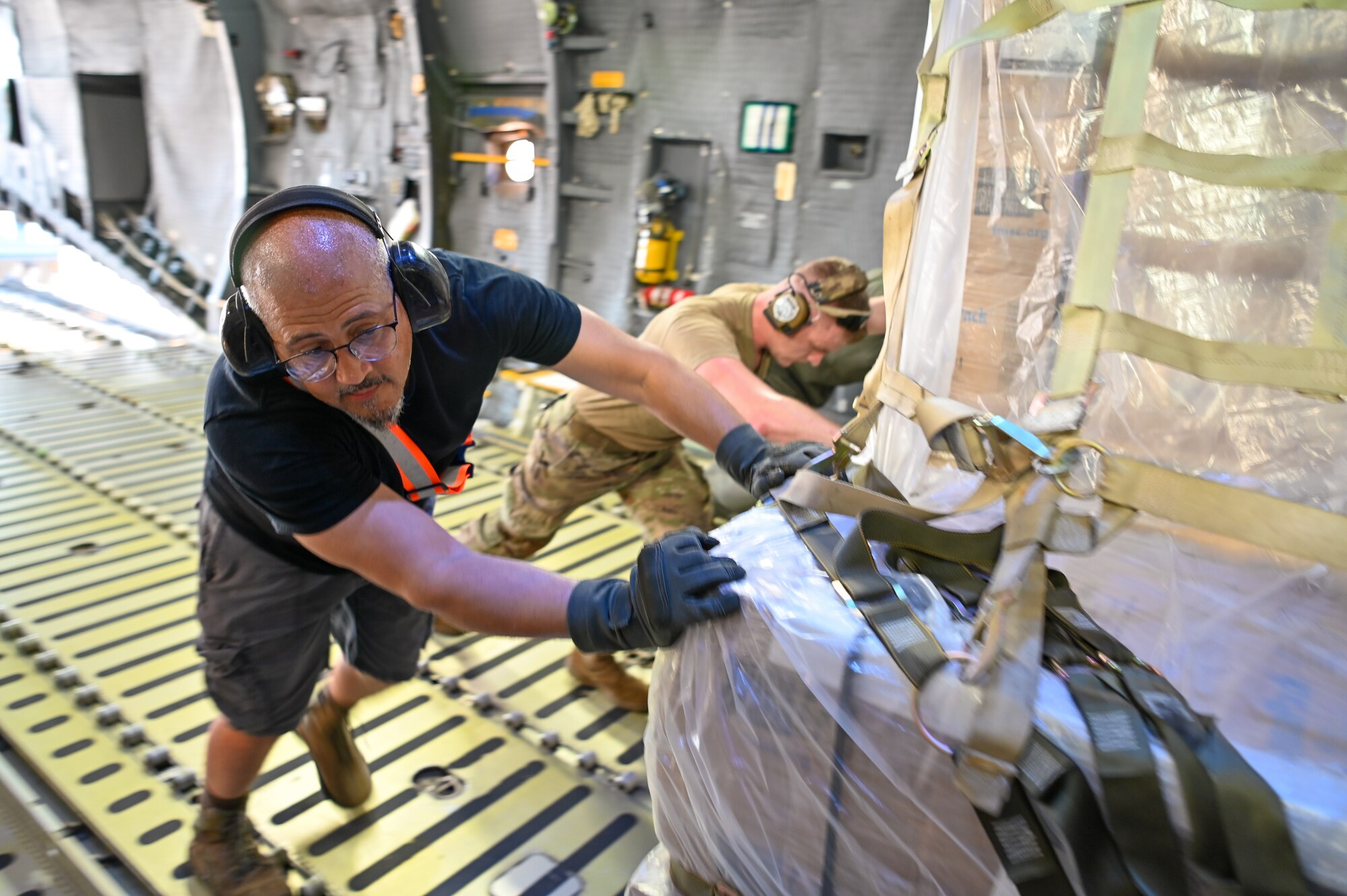 men pushing pallet