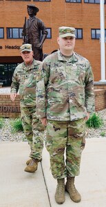 The Illinois Army National Guard's logistics directorate (G-4) took time on Sunday, June 2, to present one of their own with an Army Commendation Medal at the Illinois National Guard's headquarters on Camp Lincoln in Springfield. Lt. Col. Tim Barnhart (behind) presented the medal to Maj. Michael Lyon (front) of Bradley, Illinois, for his work as the Field Services Officer with the 34th Division Sustainment Brigade.