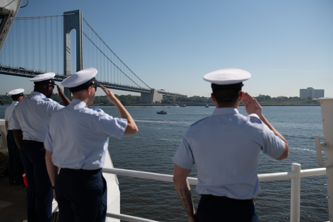 Crewmembers from the U.S. Coast Guard Cutter Calhoun (WMSL 759) salute during the parade of ships at Fleet Week in New York City, May 22, 2024. The Parade of ships is a time-honored tradition that allows the American public to see vessels of the U.S. Navy and U.S. Coast Guard transit New York Harbor. (U.S. Coast Guard photo by Lt. j. g. Adam Warren)