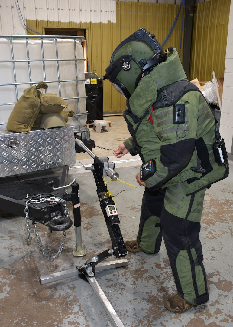 U.S. Air Force Senior Airman Benito Pacheco, EOD technician with the Nebraska Air National Guard's 155th Air Refueling Wing, prepares to employ a percusion actuated nuetralizer May 13, 2024, as part of the Audacious Warrior exercise at Volk Field Air National Guard Base in central Wisconsin. The nine day exercise was hosted by the Wisconsin ANG's 115th Fighter Wing, and included over 70 participants assigned to the Air National Guard, U.S. Air Force Reserve and U.S. Marine Corps, as well as military EOD specialists from the Czech Republic. (U.S. Air National Guard photo by Senior Master Sgt. Paul Gorman)