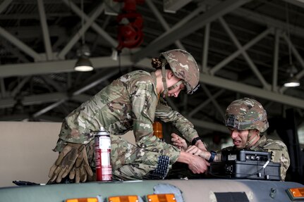 More than 5,000 Soldiers have arrived at the Joint Readiness Training Center on Fort Johnson, Louisiana, to take part in a month-long training exercise led by the 32nd Infantry Brigade Combat Team. As they arrive, the Soldiers in-process, gather gear, help offload vehicles from trains and semis, perform maintenance checks, and install MILES (multiple integrated laser engagement system) on everything from personal weapons to all varieties of vehicles, all while acclimating to the Louisiana heat and humidity.