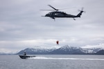 Alaska Air National Guard HH-60G Pave Hawk helicopter aviators assigned to the 210th Rescue Squadron hoist two 212th Rescue Squadron pararescuemen during underway hoist training in the Prince William Sound near Whittier, Alaska, May 16, 2024. The 212th, 210th and 211th RQSs make up the 176th Wing Rescue Triad and are among the busiest combat search and rescue units in the world.