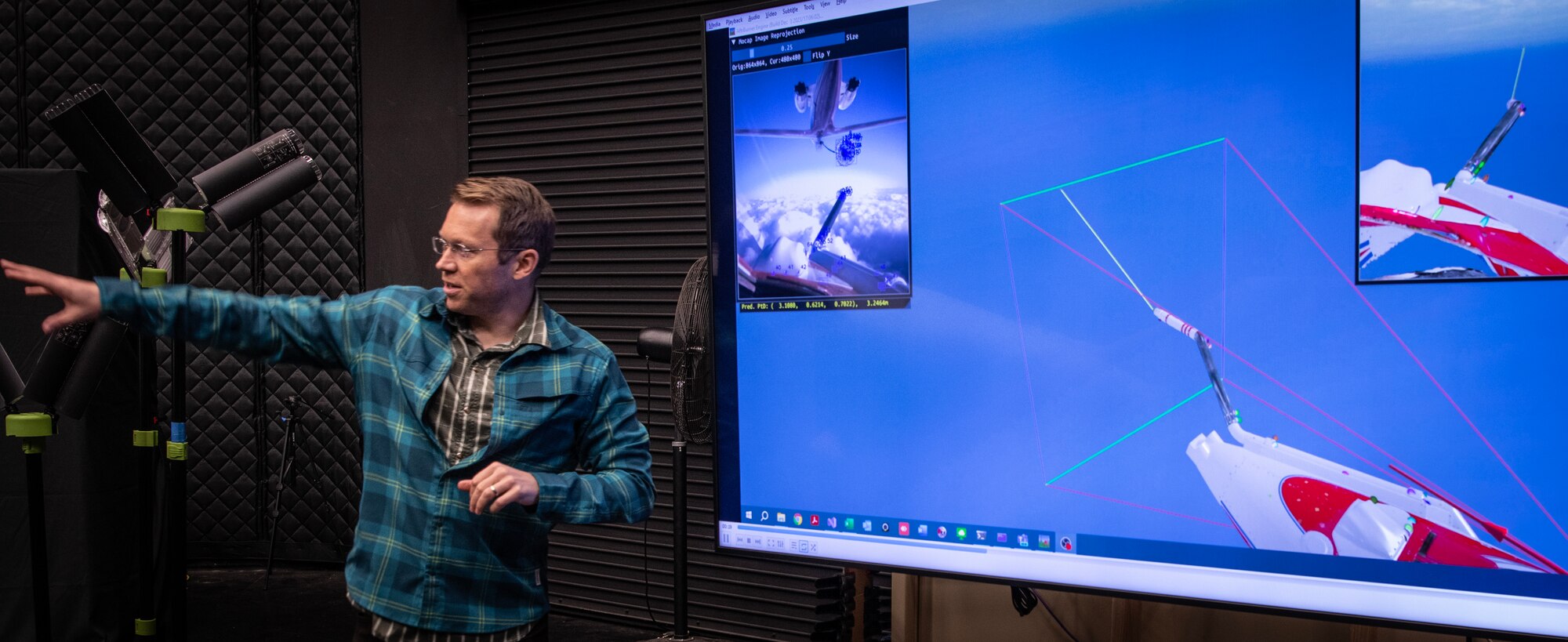 Scott Nykl explains his research in Autonomy and Navigation Technology at the Air Force Institute of Technology at Wright Patterson Air Force Base, Ohio, Feb. 21, 2024. Nykl’s research aspires to enable artificial intelligence to automate aerial refueling