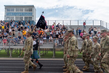 Soldiers with Company A, 1st Battalion, 178th Infantry Regiment, Illinois Army National Guard, are mobilized for deployment during a ceremony in Peoria, Illinois, June 4, 2024.