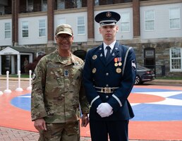 chief master sergeant of the space force poses with space force honor guardsman