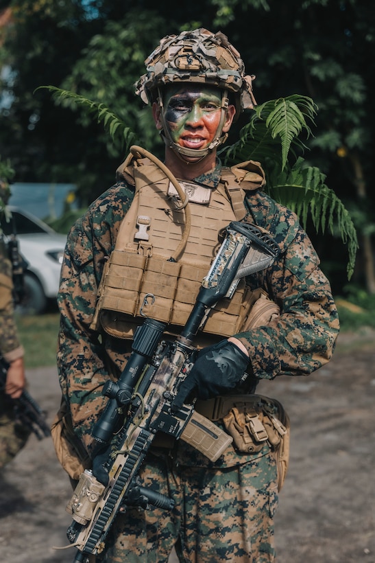 U.S. Marine Corps Pfc. Jonathan Dumadaug, a rifleman with 1st Battalion, 7th Marine Regiment, 1st Marine Division, poses for a photo after the final exercise for Archipelagic Coastal Defense Continuum in Barira, Philippines, May 28, 2024. The final exercise consisted of a bilateral company-level element conducting close-quarter combat and patrol-based operations. ACDC is a series of bilateral exchanges and training opportunities between the U.S. Marines and Philippine Marines aimed at bolstering the Philippine Marine Corps’ Coastal Defense strategy while supporting the modernization efforts of the Armed Forces of the Philippines. Dumadaug is a Philippines native. (U.S. Marine Corps photo by Sgt. Shaina Jupiter)