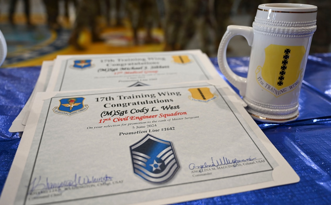 Promotion certificates lay on a table during a master sergeant release party at the Louis F. Garland Department of Defense Fire Academy, Goodfellow Air Force Base, Texas, June 5, 2024. Goodfellow congratulated 37 members for achieving this enormous career milestone as they prepare to assume senior non-commissioned officer’s duties. (U.S. Air Force photo by Airman 1st Class Madison Collier)