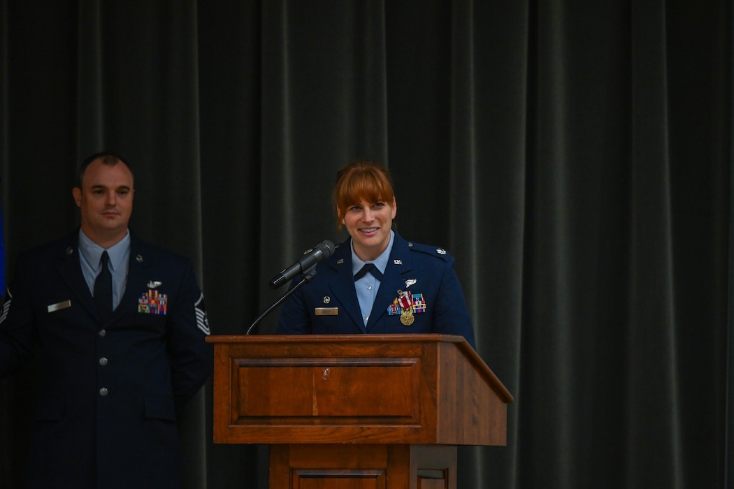 A commander speaks at a podium