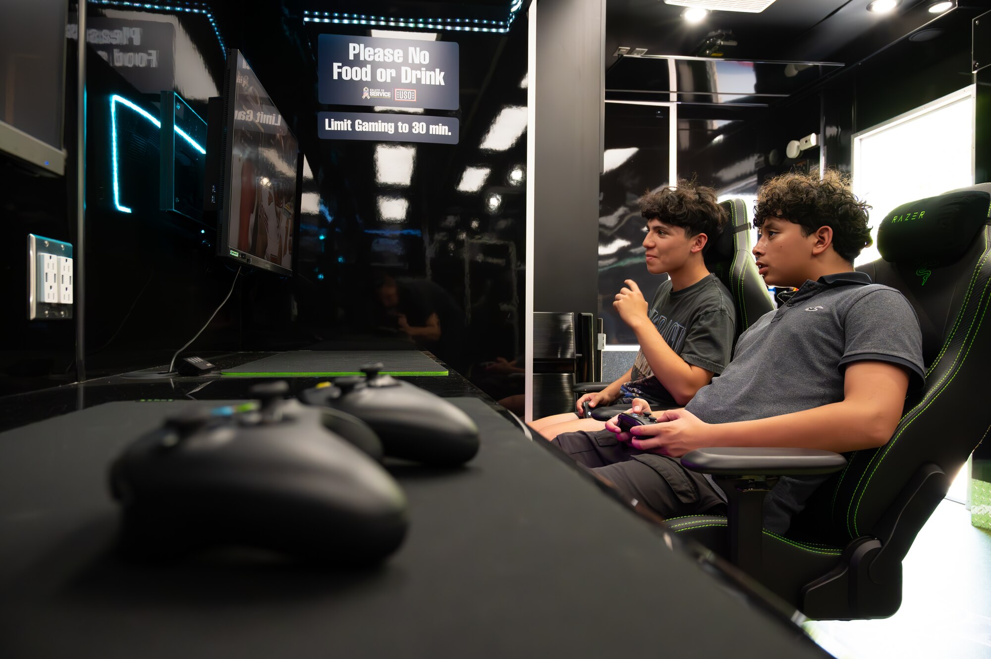 U.S. Air Force Airmen, get together to compete in gaming tournaments hosted by the USO outside the Losano Fitness Center on Laughlin Air Force Base, Texas, June 2, 2024. Friendly competition is one of the ways airmen can build camaraderie amongst each other. (U.S. Air Force photo by Airman 1st Class Harrison Sullivan)