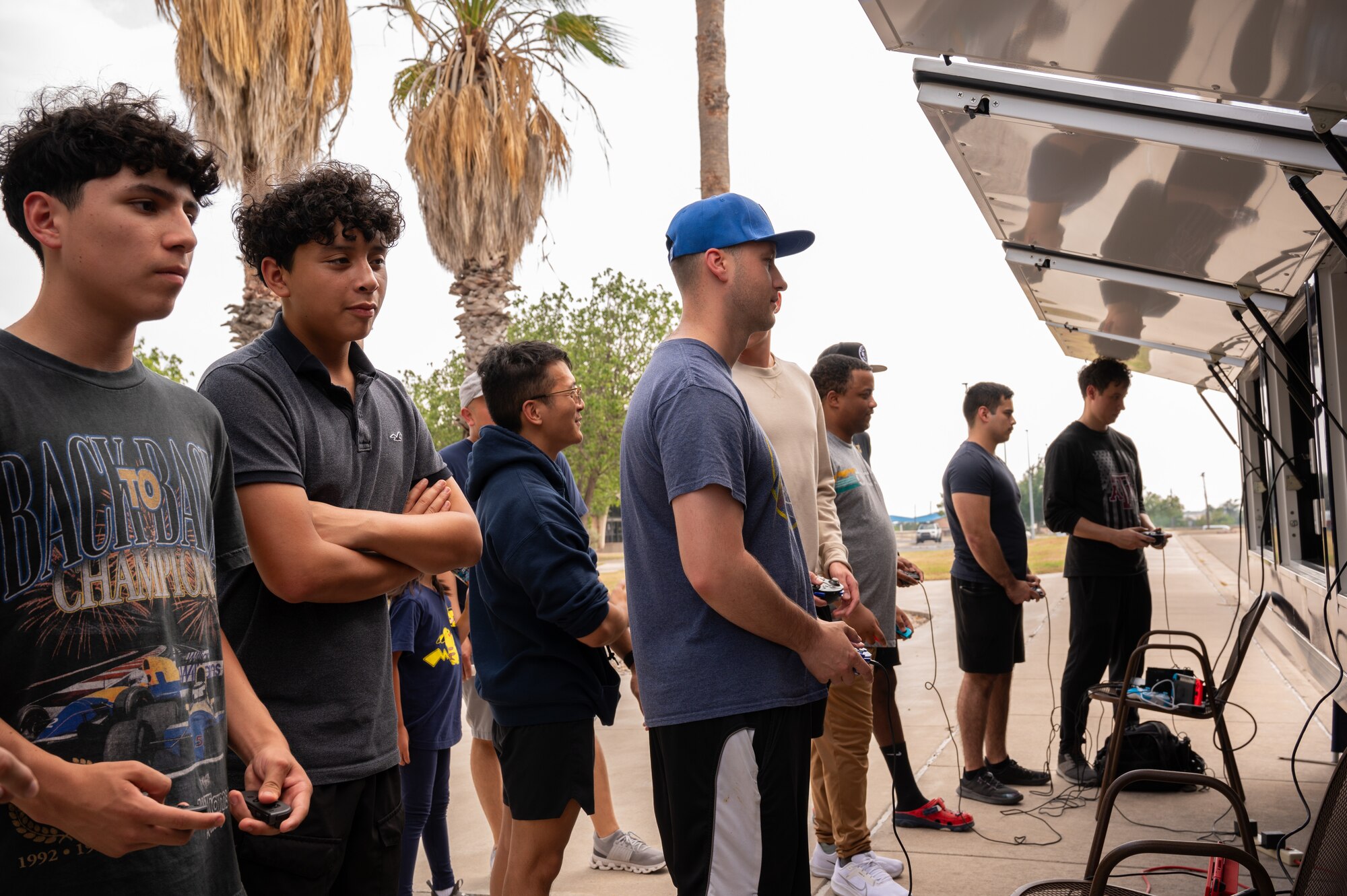 U.S. Air Force Airmen, get together to compete in gaming tournaments hosted by the USO outside the Losano Fitness Center on Laughlin Air Force Base, Texas, June 2, 2024. Friendly competition is one of the ways airmen can build camaraderie amongst each other. (U.S. Air Force photo by Airman 1st Class Harrison Sullivan)