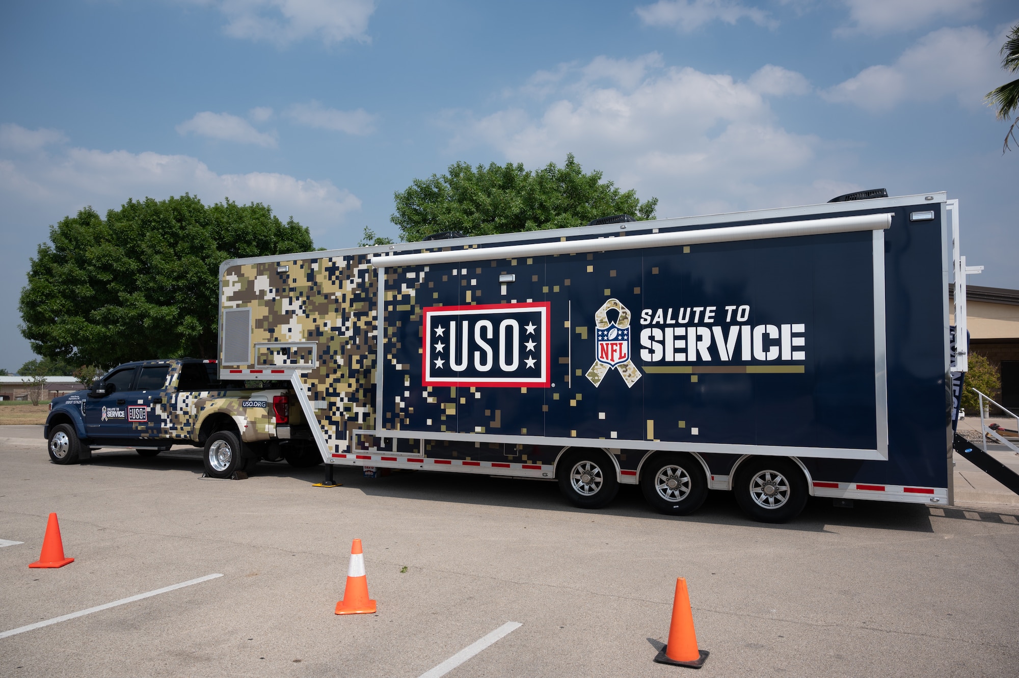 The USO-NFL partnered mobile gaming trailer, parks in front of the Losano Fitness Center on Laughlin Air Force Base, Texas, June 2, 2024. The mobile gaming unit travels to different military installations, providing video games and other fun activities to boost the morale of service members. (U.S. Air Force photo by Airman 1st Class Harrison Sullivan)