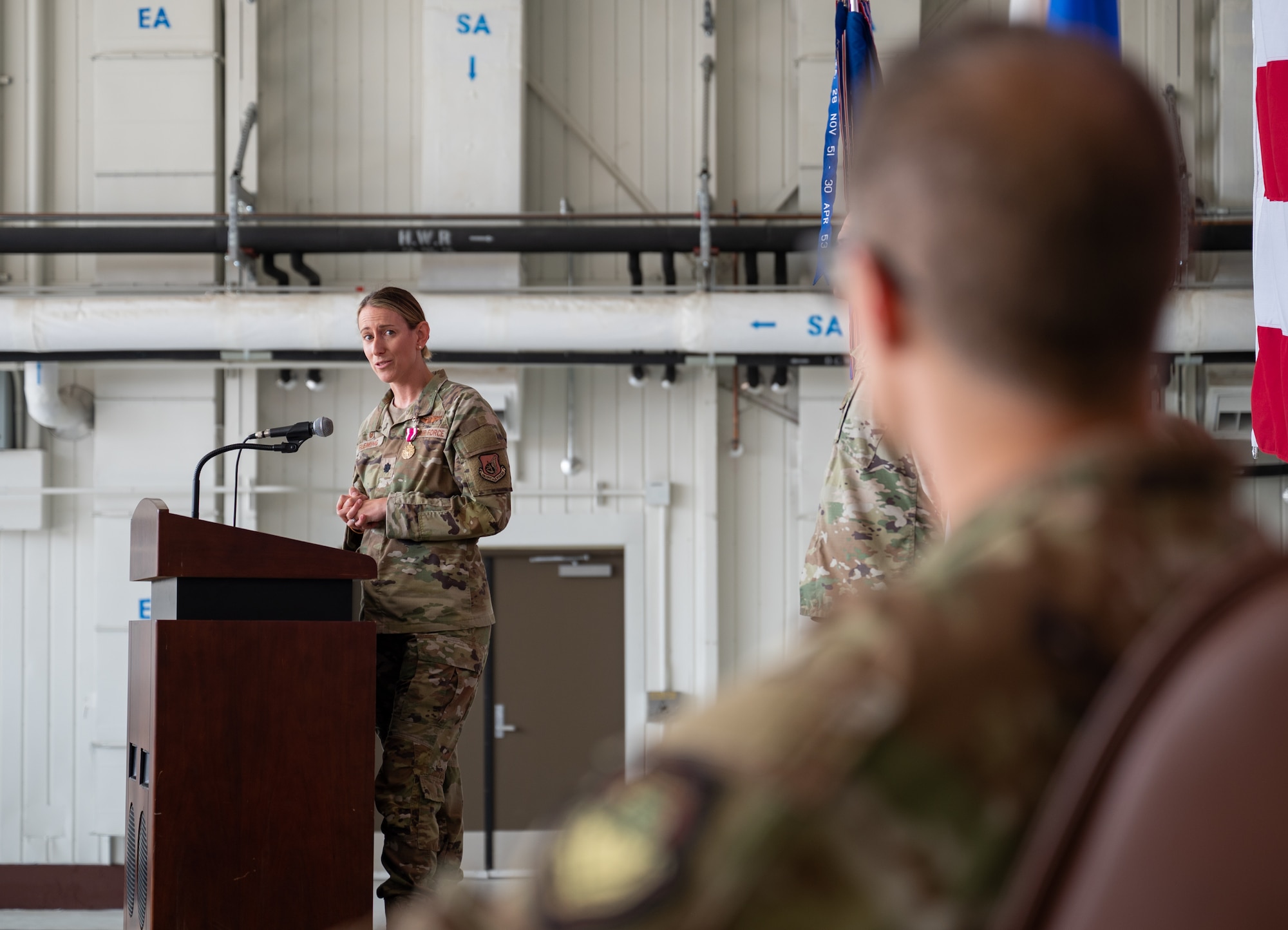 U.S. Air Force Lt. Col. Chandra R. Fleming, 51st Operations Support Squadron commander, gives a speech during a change of command ceremony at Osan Air Base, Republic of Korea, June 5, 2024. A change of command ceremony is a tradition that signifies the seamless transition of leadership and reinforces the 51st Fighter Wing’s dedication to executing the mission. (U.S. Air Force photo by Senior Airman Brittany Russell)