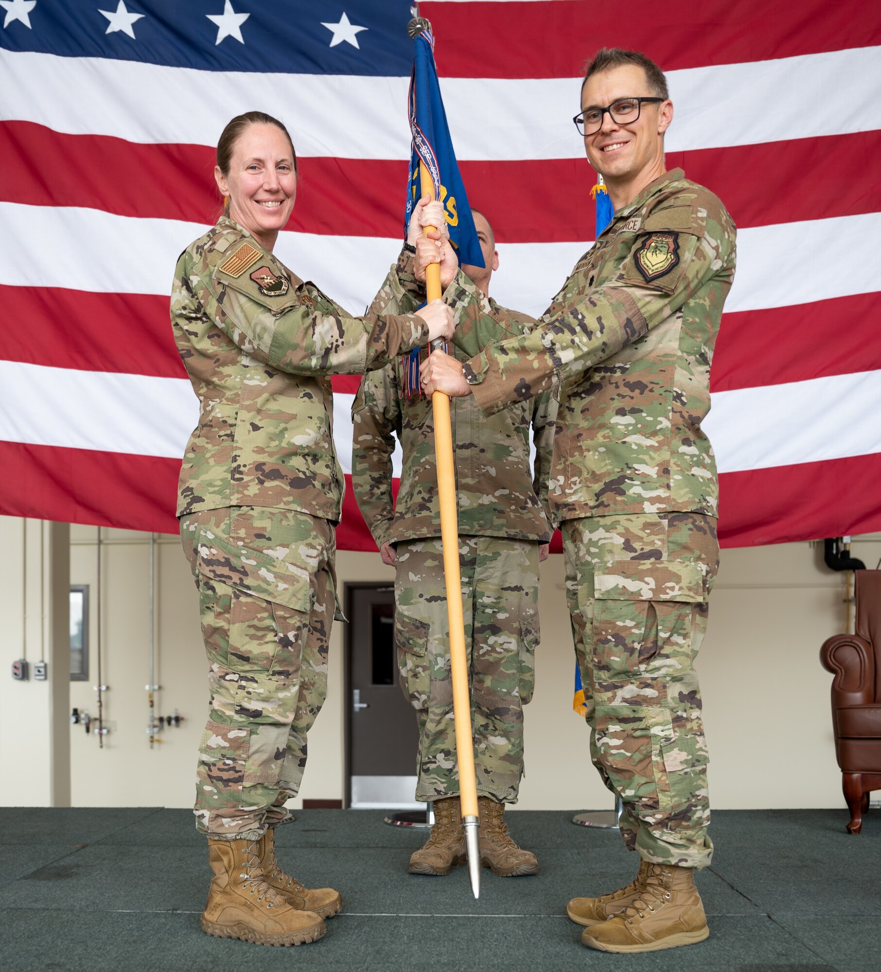 U.S. Air Force Lt. Col. Joseph M. Morrin, right, accepts command of the 51st Operations Support Squadron from Col. Kathryn K. Gaetke, left, 51st Operations Group commander, during a change of command ceremony at Osan Air Base, Republic of Korea, June 5, 2024. Prior to taking command, Morrin served as the director of operations for the 75th Fighter Squadron at Moody Air Force Base, Georgia. (U.S. Air Force photo by Senior Airman Brittany Russell)