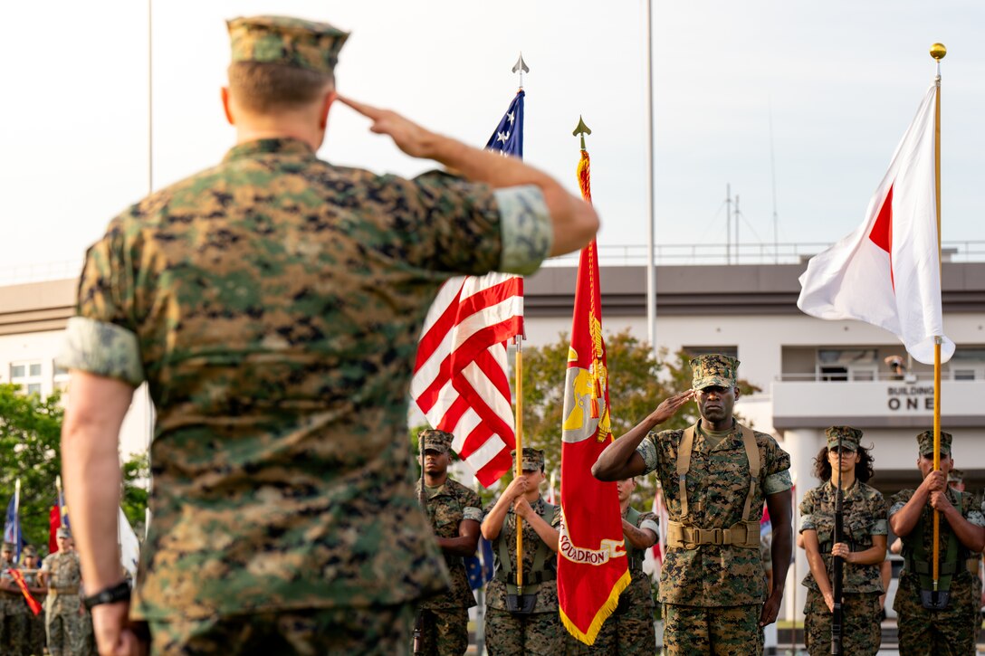U.S. Marine Corps Lt. Col. Jacob Schwinghammer, left, the commanding officer of Headquarters and Headquarters Squadron, Marine Corps Air Station Iwakuni, and Florida native, renders a salute back to Sgt Maj. Jorge Cedeno-Tulloch, right, the former sergeant major of H&HS, MCAS Iwakuni, and native of Panama, during a relief and appointment ceremony at MCAS Iwakuni, Japan, June 5, 2024. Relief and appointment ceremonies are a tradition that serve to represent the transition of responsibility from one sergeant major to another. (U.S. Marine Corps photo by Sgt. Raymond Tong)