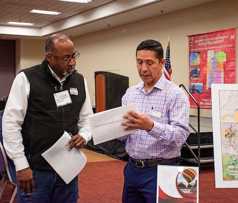 Brian Sanchez, project manager in the Civil Project Management Branch, speaks with one of the attendees of the Albuquerque District’s Business Opportunities Open House event at the Albuquerque Convention Center, March 21, 2024.