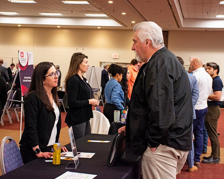 Stephanie Parra, deputy of the Albuquerque District’s Small Business Program, speaks with one of the attendees during the Business Opportunities Open House event at the Albuquerque Convention Center, March 21, 2024.