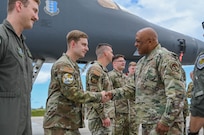 Gen. Anthony Cotton, commander, U.S. Strategic Command, shakes hands and awards a commander’s coin to Senior Airman Nicholas Early, 28th Operations Support Squadron combat crew communications lead at Andersen Air Force Base, Guam, June 3, 2024, during a base tour. As part of his visit, Cotton took the opportunity to interact and recognize Airmen within the 37th EBS as they conduct Bomber Task Force 24-6 missions. BTF missions enable crews to maintain a high state of readiness and proficiency and validate our always-ready global strike capability. (U.S. Air Force photo by Airman 1st Class Dylan Maher)