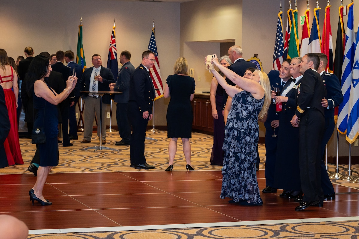 People gather for selfie during the AFSAC FLO International reception