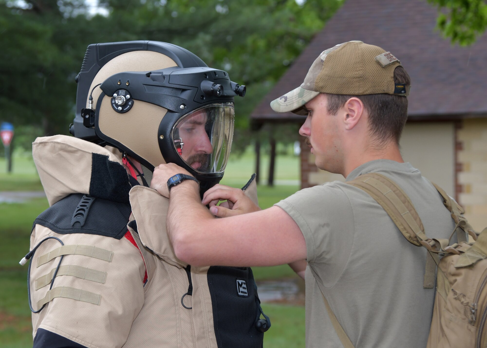 U.S. Air Force Airman 1st Class Samuel Breyer, explosive ordnance disposal technician with the Minnesota Air National Guard's 148th Fighter Wing, helps Senior Airman Niel Wegley, EOD technician with the Nebraska ANG's 155th Air Refueling Wing, don a Med-Eng EOD-10 bomb suit May 13, 2024, as part of the Audacious Warrior exercise at Volk Field Air National Guard Base in central Wisconsin. The nine-day exercise was hosted by the Wisconsin ANG's 115th Fighter Wing and included over 70 participants assigned to the Air National Guard, U.S. Air Force Reserve and U.S. Marine Corps, as well as military EOD specialists from the Czech Republic. (U.S. Air National Guard photo by Senior Master Sgt. Paul Gorman)
