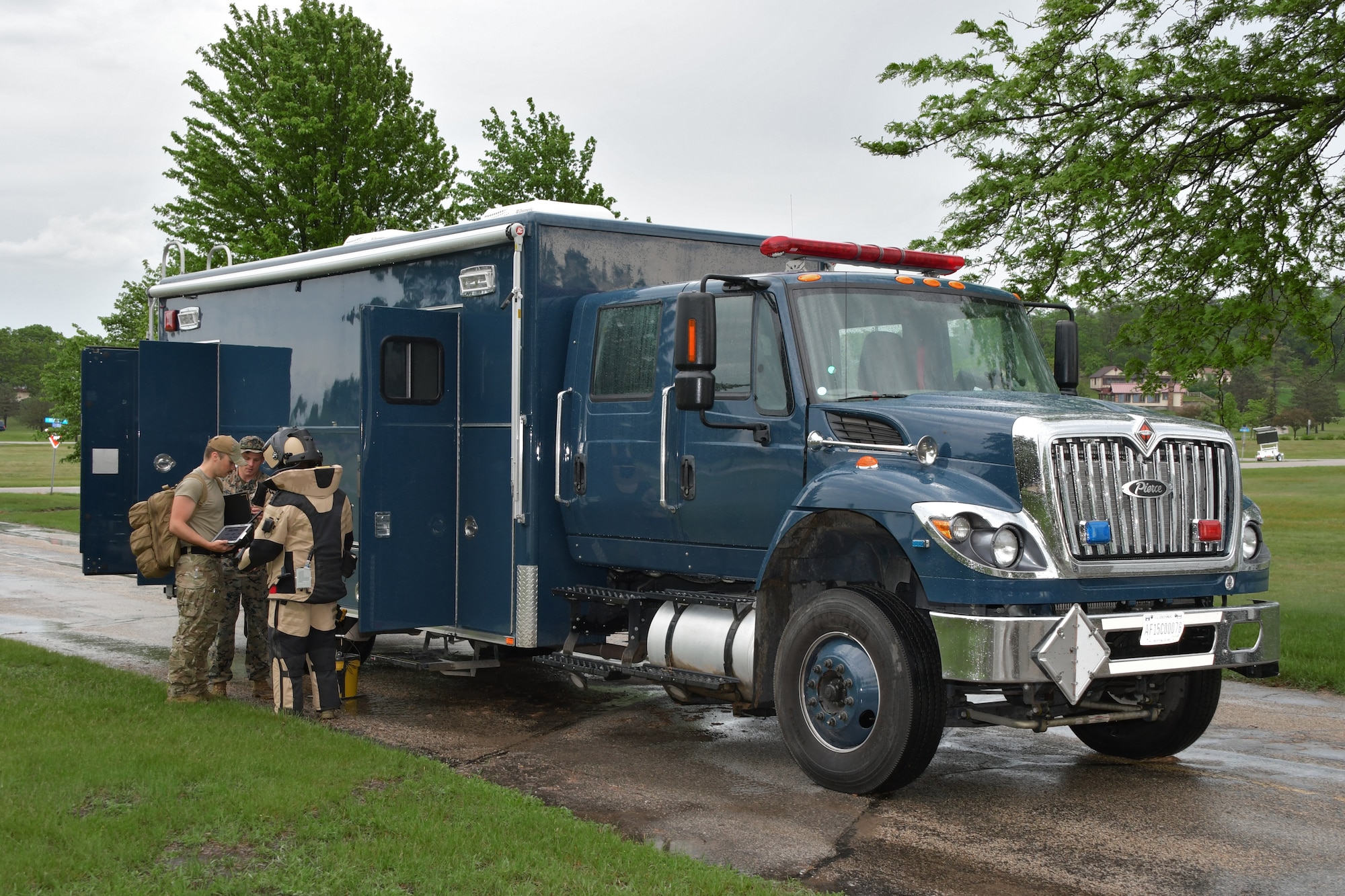 A joint team of U.S. Marine and U.S. Air National Guard explosive ordnance disposal technicians prepare to manually approach a potential explosive threat May 13, 2024, as part of the Audacious Warrior exercise at Volk Field Air National Guard Base in central Wisconsin. The nine-day exercise was hosted by the Wisconsin Air National Guard's 115th Fighter Wing and included over 70 participants assigned to the Air National Guard, U.S. Air Force Reserve and U.S. Marine Corps, as well as military EOD specialists from the Czech Republic. (U.S. Air National Guard photo by Senior Master Sgt. Paul Gorman)