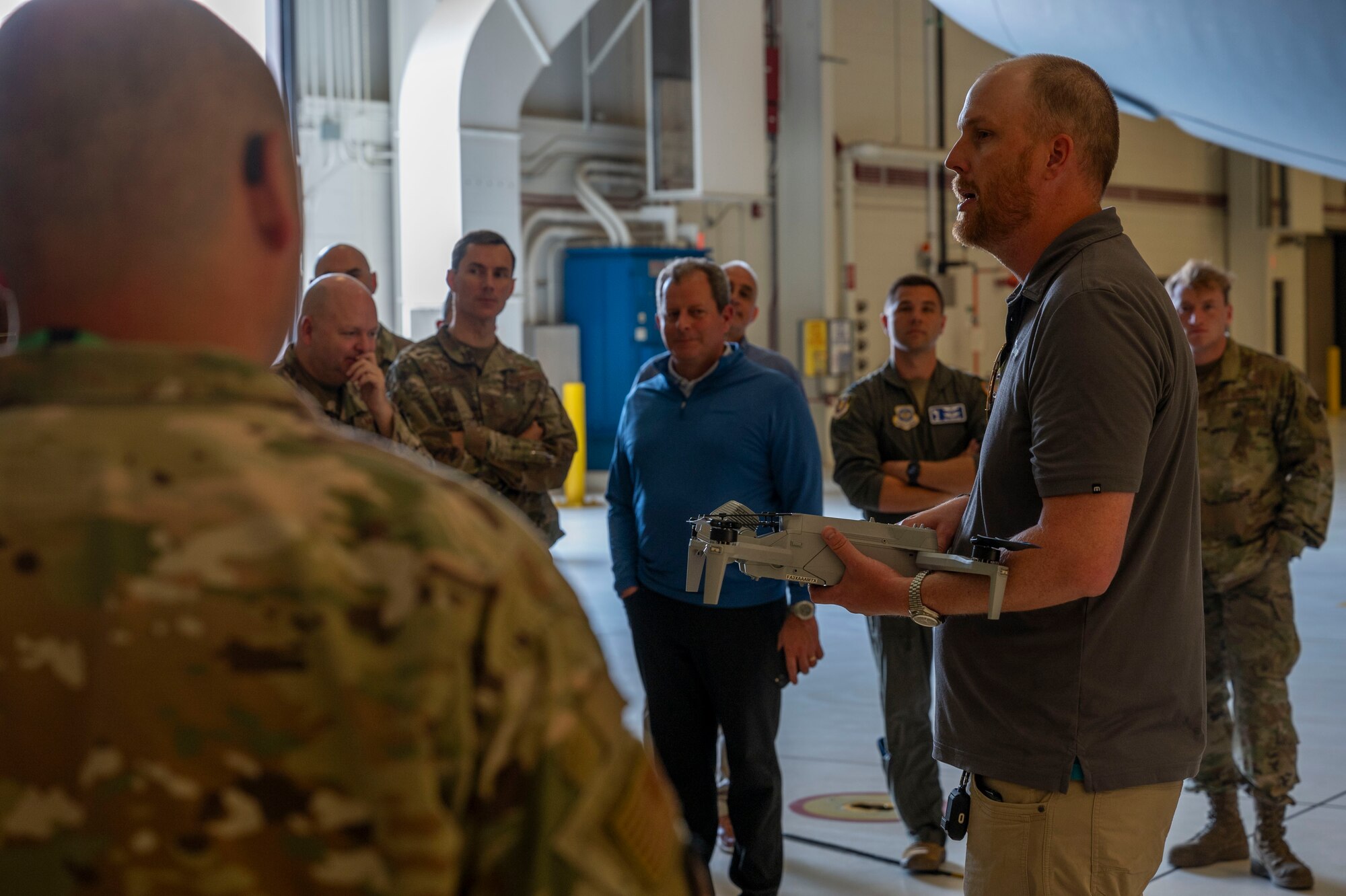 Andrew Profitt, Skydio senior solutions engineer, gives a demonstration of Skydio’s X10D drone to Airmen from the 22nd Air Refueling Wing May 29, 2024, at McConnell Air Force Base, Kansas. Boeing and drone manufacturer Skydio collaborated with McConnell's innovation lab to introduce a new drone program to wing leadership and future operators. (U.S. Air Force photo by Airman 1st Class Gavin Hameed)