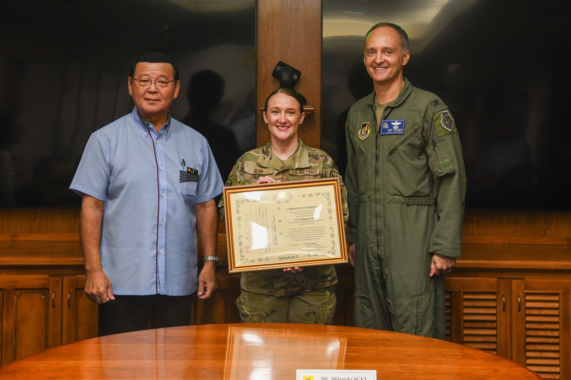 U.S. Air Force 1st Lt. Regina E. Bean poses after receiving a  certificate of appreciation.