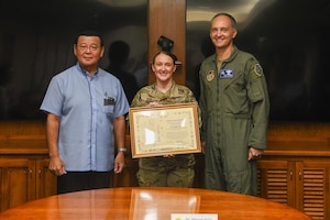U.S. Air Force 1st Lt. Regina E. Bean poses after receiving a  certificate of appreciation.