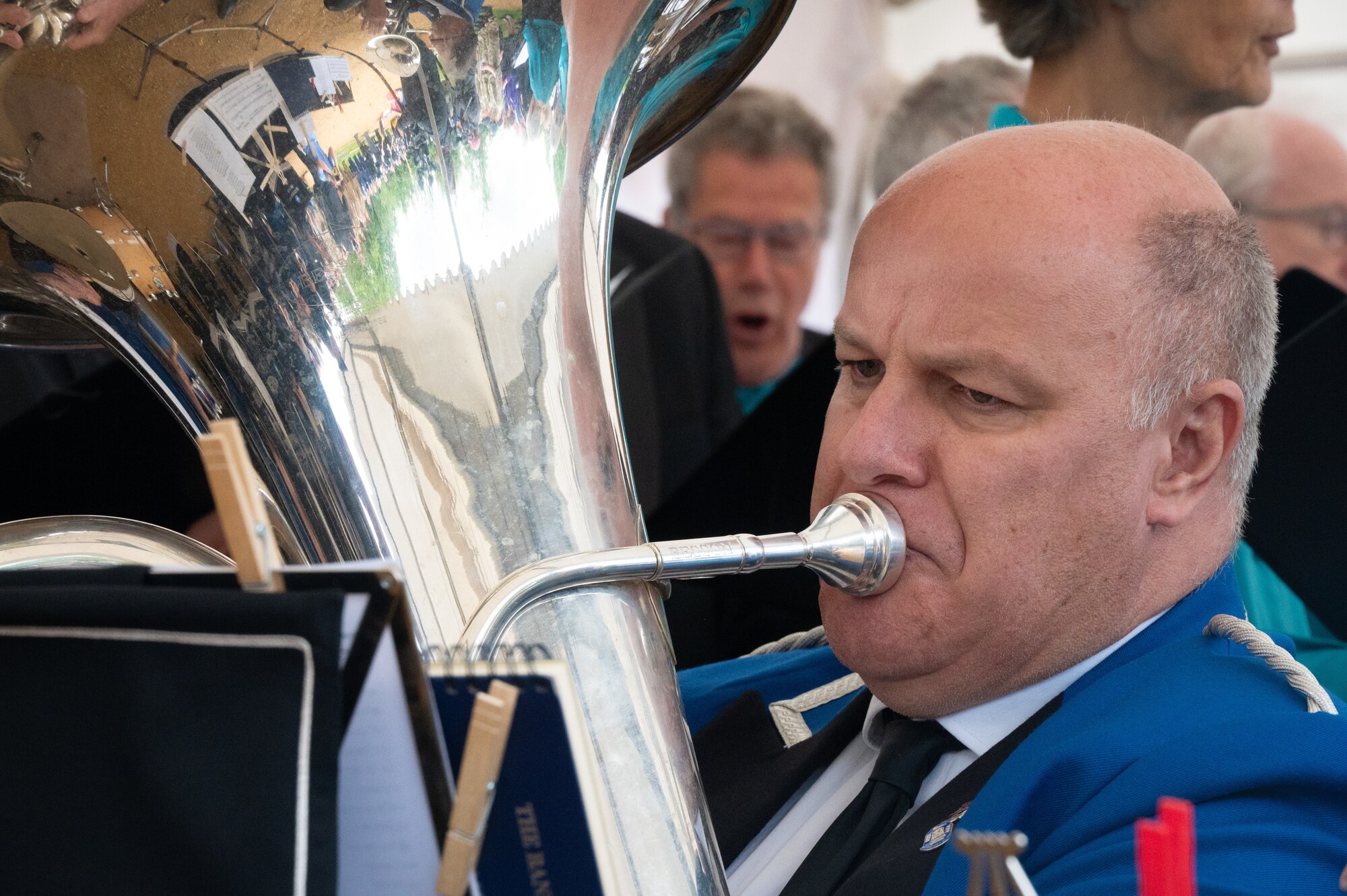 A tuba player from the Watership brass band plays the Star-Spangled Banner.
