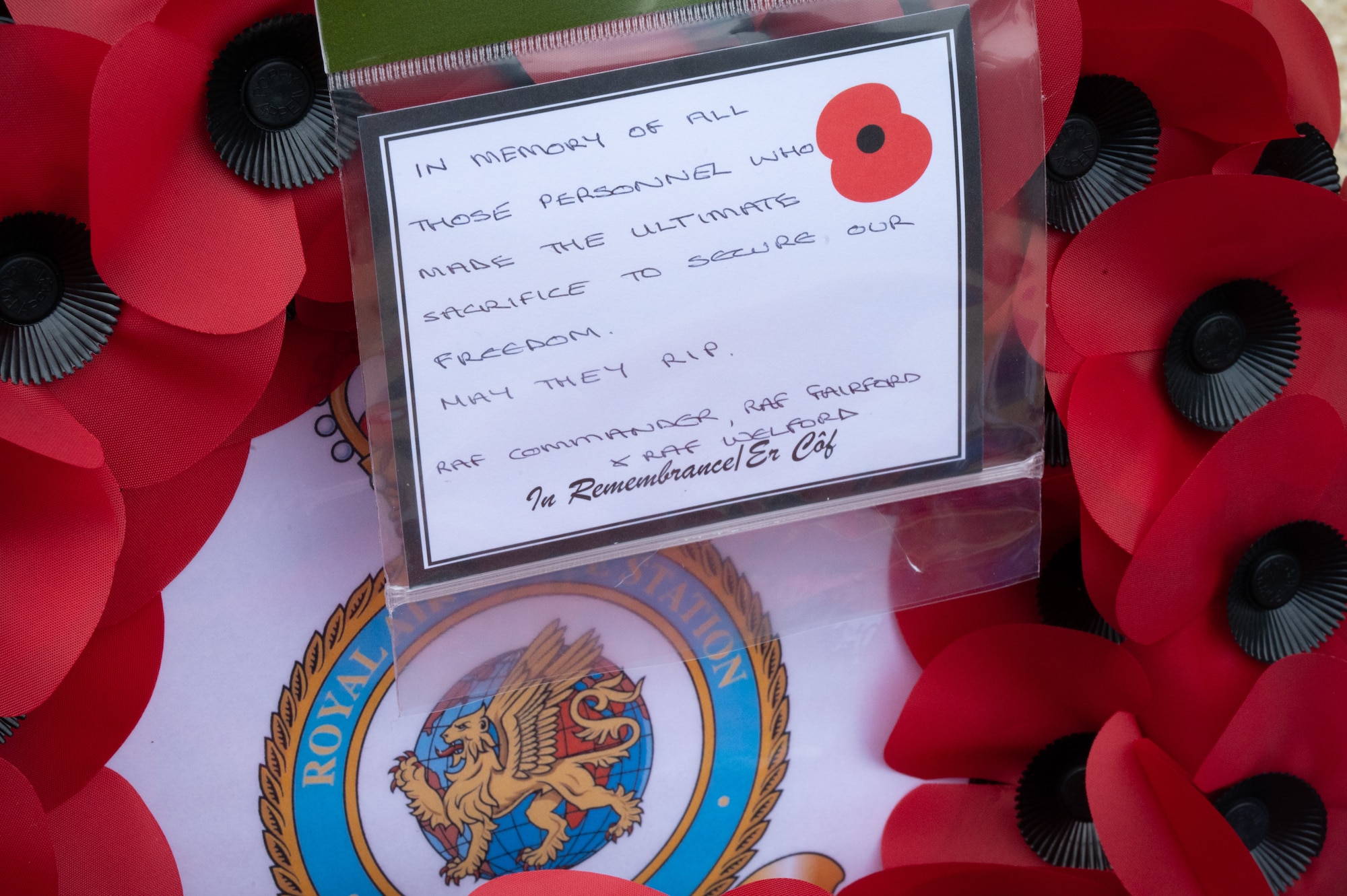 A wreath from the Royal Air Force, RAF Fairford and RAF Welford sits at the Greenham Tower Memorial.