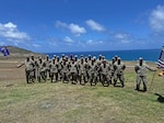Airmen from the 173rd Security Forces Squadron from Kingsley Field, Oregon, pose for a group photo during their annual training exercise May 4, 2024, at Marine Corps Air Station at Kaneohe Bay in Oahu, Hawai'i.