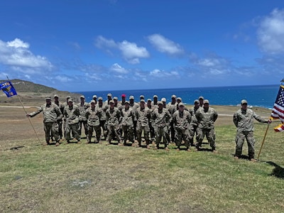 Airmen from the 173rd Security Forces Squadron from Kingsley Field, Oregon, pose for a group photo during their annual training exercise May 4, 2024, at Marine Corps Air Station at Kaneohe Bay in Oahu, Hawai'i.