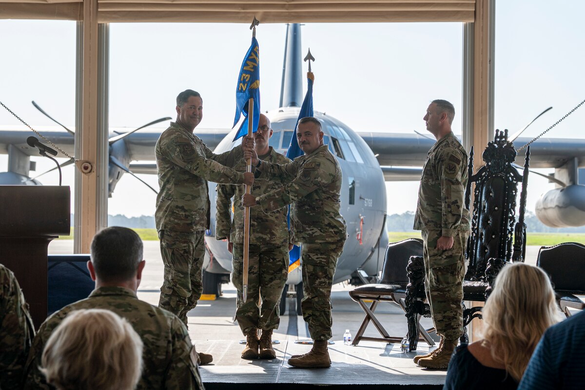 U.S. Air Force Maj. Stephen Cox, right, 71st Rescue Generation Squadron incoming commander, receives the guidon from Col. Bobby Buckner, 23rd Maintenance Group commander, during a change of command ceremony at Moody Air Force Base, Georgia, June 3, 2024. Cox was the officer-in-charge of the Maintenance Operations flight at Moody AFB, leading 156 personnel across six sections and 19 Air Force Specialty Codes. (U.S. Air Force photo by Airman 1st Class Leonid Soubbotine)