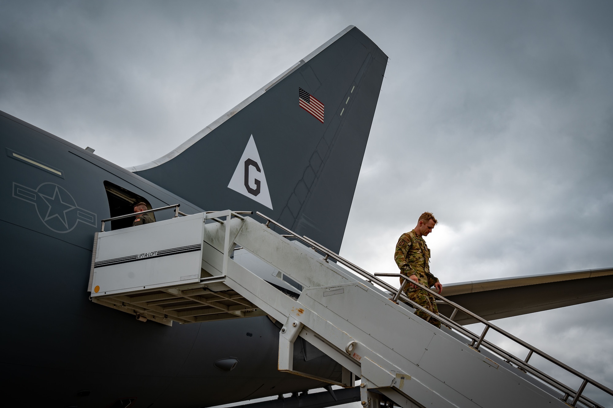 A U.S. Air Force pilot assigned to the 305th Air Mobility Wing deboards a KC-46 Pegasus at Royal Air Force Mildenhall, England, May 23, 2024. The 305th AMW traveled to Chelveston, England, for the third consecutive year to honor the legacy of the 305th Bombardment Group, the wing's predecessor. (U.S. Air Force photo by 2nd Lt. Alexis Kula)