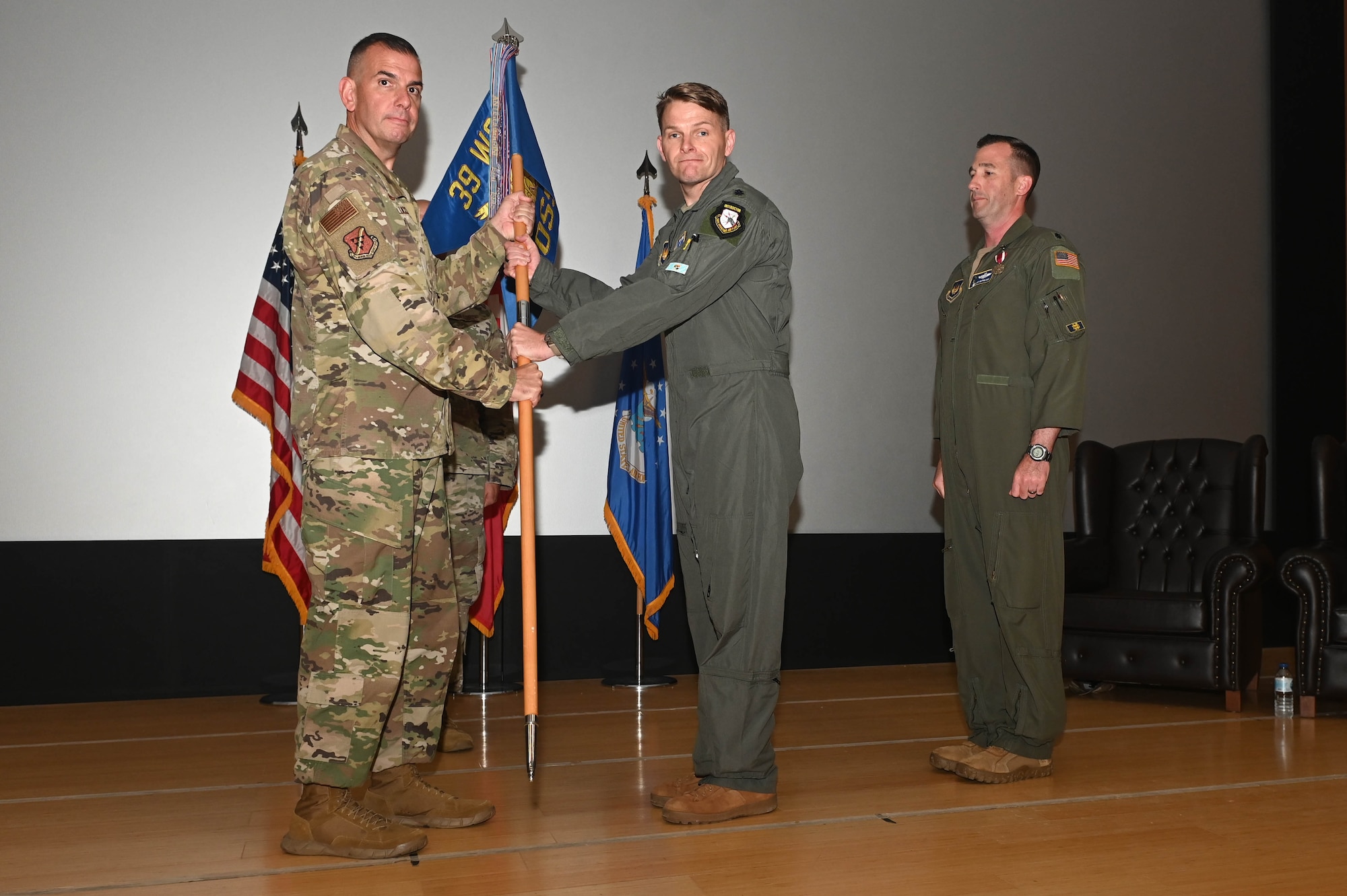 U.S. Air Force Lt. Col. Travis Halleman, 39th Operations Support Squadron commander, receives the unit guidon from U.S. Air Force Col. Michael Galucci, 39th Weapons System Security Group commander, during a change of command ceremony at Incirlik Air Base, Türkiye, June 7, 2024. The 39th OSS leads world-class airfield & support operations to orchestrate and control US, Turkish, and partner forces operating at Incirlik Air Base in the execution of deterrence operations. (U.S. Air Force photo by Staff Sgt Alexandria Lee)