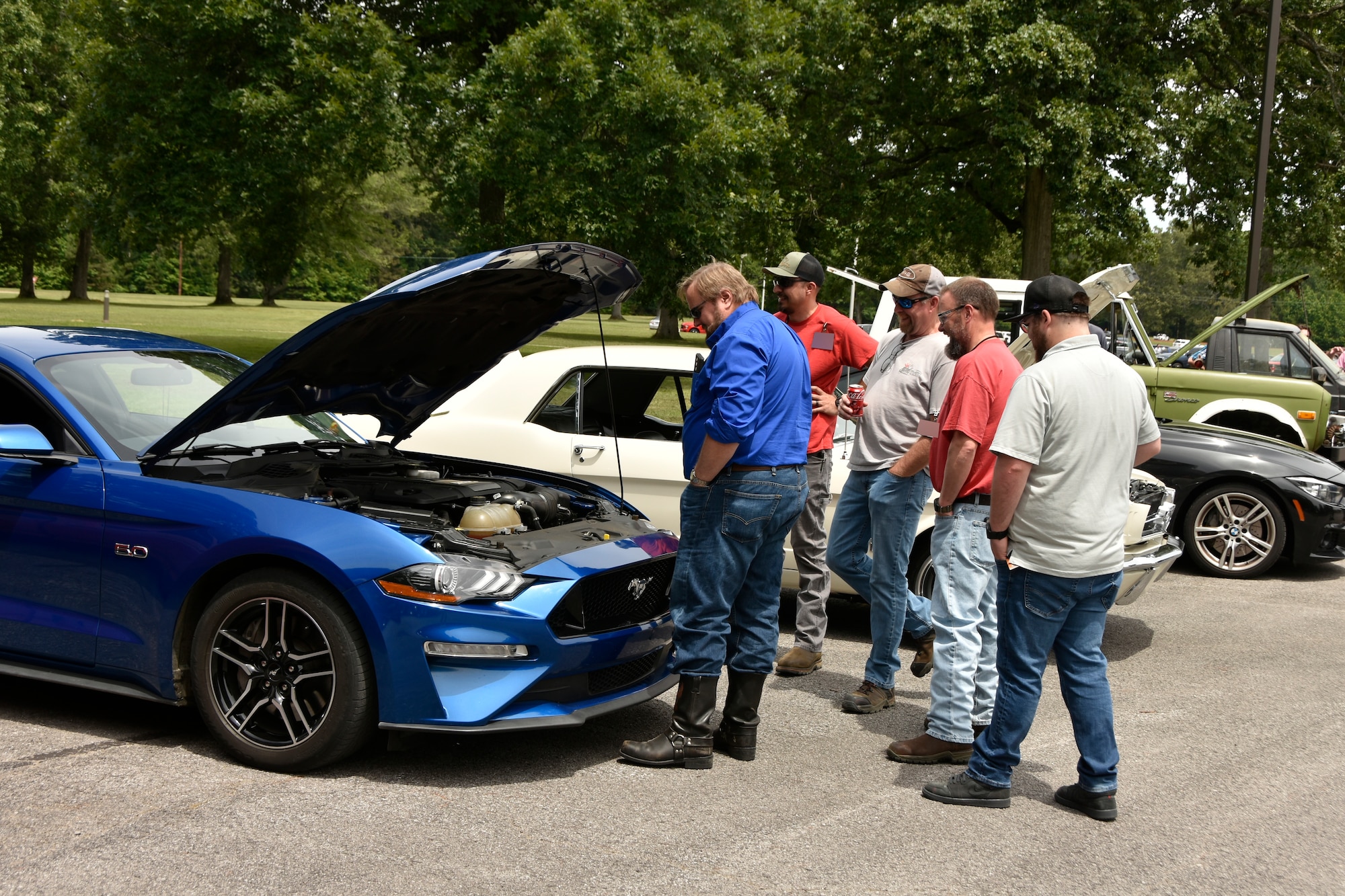 Arnold Air Force Base team members check out some of the vehicles on display during the 2024 CGOC Auto Show & Burger Burn at Arnold AFB, Tenn., May 31, 2024. The event, hosted by the Arnold AFB Company Grade Officers’ Council, was held to raise money for the Arnold AFB Air Force Ball to be held later this year. (U.S. Air Force photo by Bradley Hicks) (This image was altered by obscuring badges for security purposes)

Disclaimer: The CGOC is a private organization which is not part of the Department of Defense or any of its components and has no governmental status.