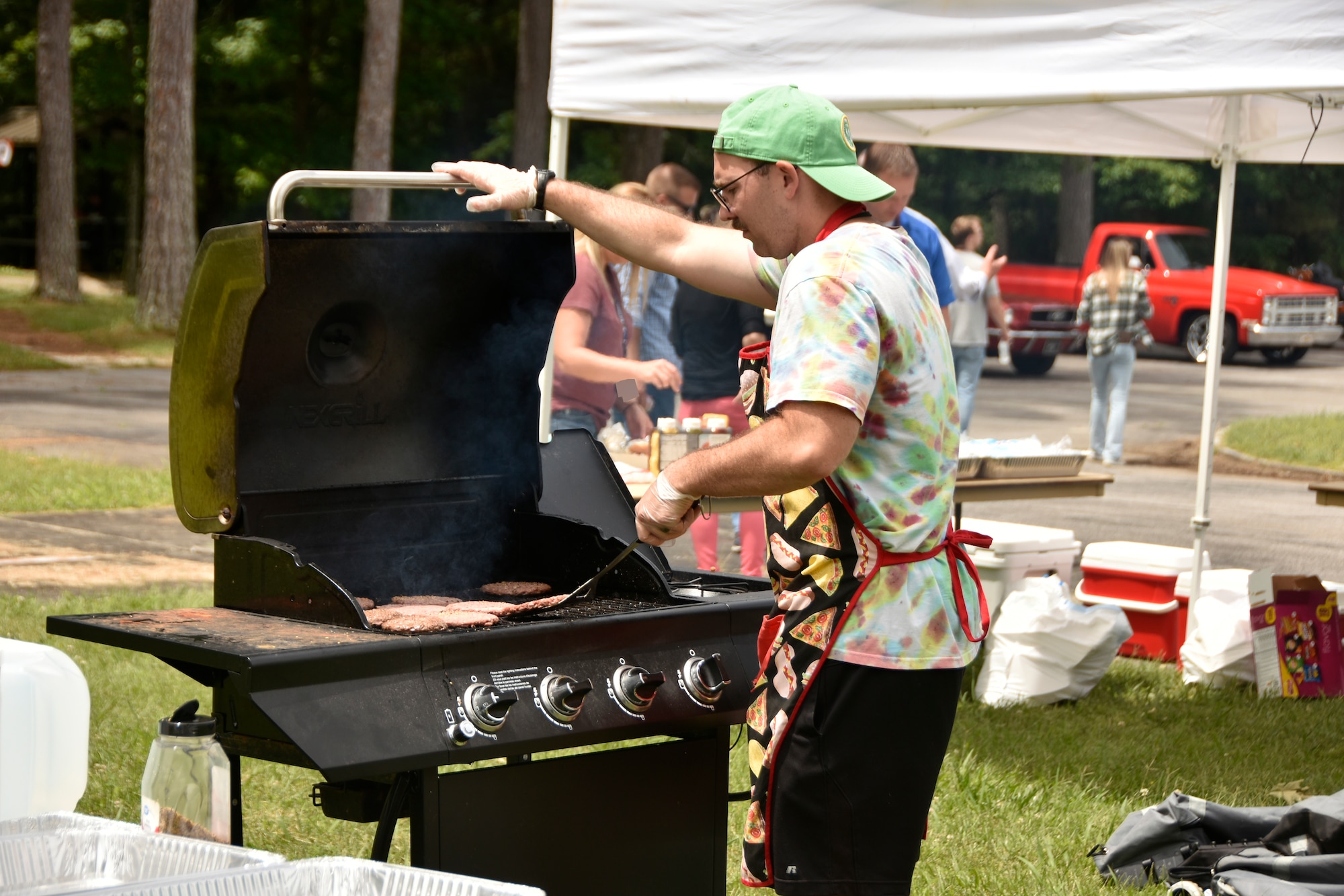 1st Lt. John Simpson with the Arnold Air Force Base Company Grade Officers’ Council prepares hamburgers May 31, 2024, for attendees of the 2024 CGOC Auto Show & Burger Burn at Arnold AFB, Tenn. The event, hosted by the Arnold AFB CGOC, was held to raise money for the Arnold AFB Air Force Ball to be held later this year. (U.S. Air Force photo by Bradley Hicks) (This image was altered by obscuring badges for security purposes)

Disclaimer: The CGOC is a private organization which is not part of the Department of Defense or any of its components and has no governmental status.
