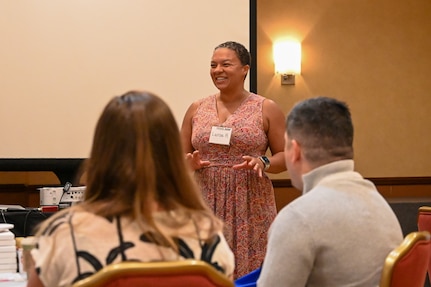 Larisa Harrington, wellbeing coach at Strong By Nature, introduces herself to the participants of the Joint Base Anacostia-Bolling wellness retreat weekend in Herndon, Virginia on May 3, 2024.  Harrington invited the audience to reflect on the four pillars of life: values, joys, strengths and needs. (U.S. Air Force photo by Airman Shanel Toussaint)